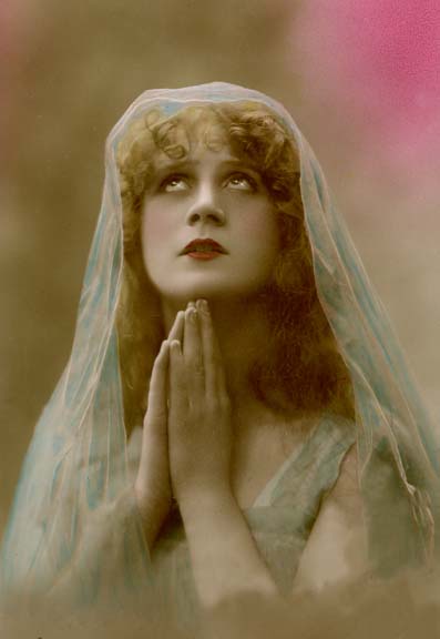 Tinted postcard of Pretty Lady praying c.1911